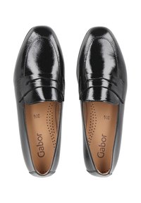 Black patent leather loafers with a smooth, shiny finish. Designed with a rounded toe and a decorative strap across the front.