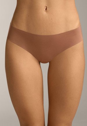 Woman wearing seamless brown hipster underwear, showing midsection and upper thighs against a neutral background.