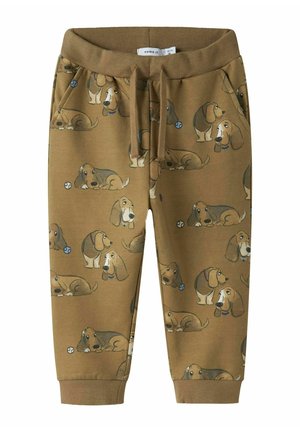 Braune Sweatpants mit einem verspielten Druck von einem Foxhound, mit elastischem Bund und Bündchen, aus weichem Baumwollmaterial für zusätzlichen Komfort.