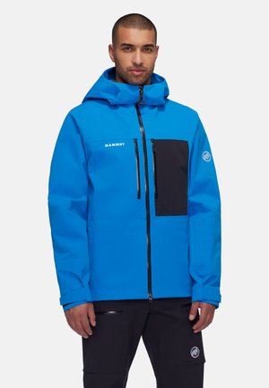 Veste imperméable bleu vif avec une poche poitrine noire, fermeture éclair, capuche réglable et poignets élastiques. Convient pour les activités en plein air.