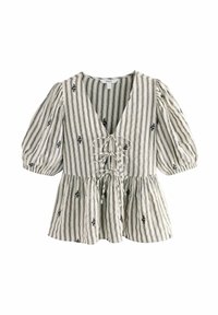 Haut en tissu rayé avec manches bouffantes, décolleté en V profond, détail à nouer au niveau de la poitrine, accents floraux noirs sur fond crème.