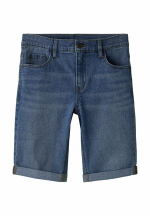 Tumedat pesu teksapüksid, millel on klassikaline viiepokiline disain, üles volditud ääred ja õmmeldud vöökoht ees nööpkinnitusega.