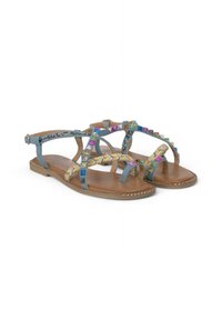 Blauwe stoffen sandalen met multiculturele decoratieve studs en geweven accenten. Platte zool met een bruine leren voetbed en verstelbare enkelriem.
