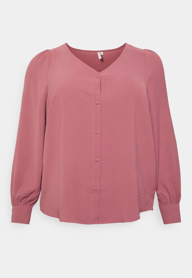 Blouse rose poussière à manches longues avec col en V, boutons recouverts de tissu sur le devant, poignets froncés et léger détail de manche bouffante.