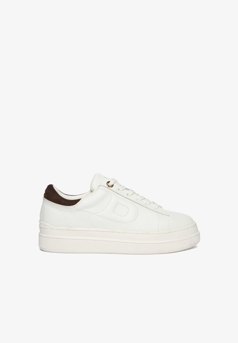 White leather sneaker with a textured finish, brown suede heel accent, flat laces, and a thick rubber sole. Gold eyelet detail.