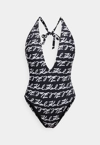 Μαύρο μαγιό με βαθύ V λαιμόκοψη και τιράντες halter, με λευκό σχέδιο γραφής σε όλη την επιφάνεια. Λείο ύφασμα με εφαρμοστή σιλουέτα.