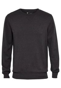 Pull gris foncé à col rond en tissu tricoté doux. Il présente des poignets et un ourlet côtelés, avec un logo discret sur la poitrine.