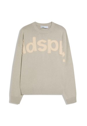Maglione beige chiaro lavorato a maglia con polsini e orlo a coste, caratterizzato da grandi lettere beige ricamate sul petto che compongono parzialmente la scritta "adspl".