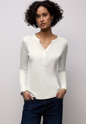 - Bluzka z długim rękawem