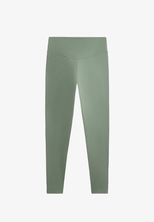 Zelene legginge iz gladkega, raztegljivega materiala z visokim pasom. Imajo prilegajoč dizajn in brez izrazitih vzorcev ali akcentov.