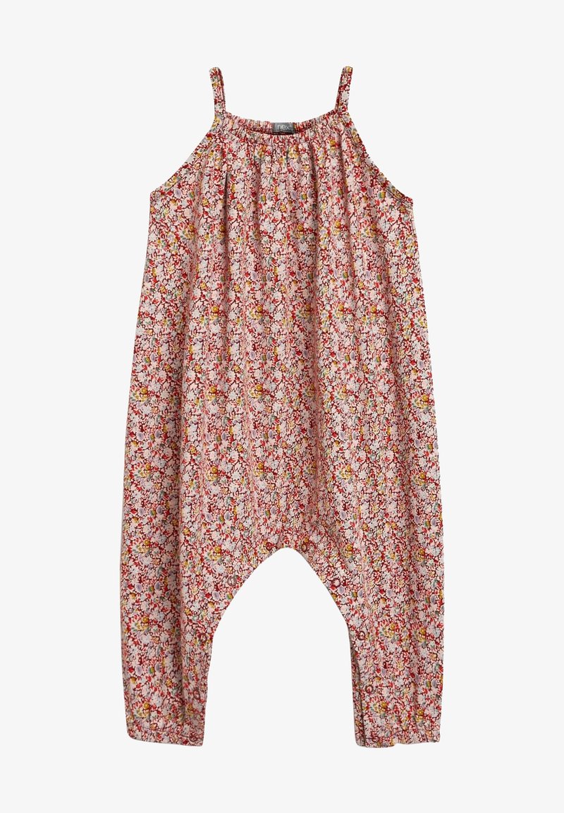 Combinaison ample sans manches avec fines bretelles et motif floral rose, dotée d'une entrejambe basse et d'un col froncé.