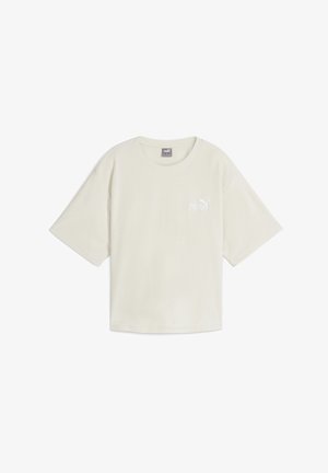 Cremefarvet t-shirt med korte ærmer i blød bomuld, med rund halsudskæring og lille hvid Puma-logo på venstre bryst.