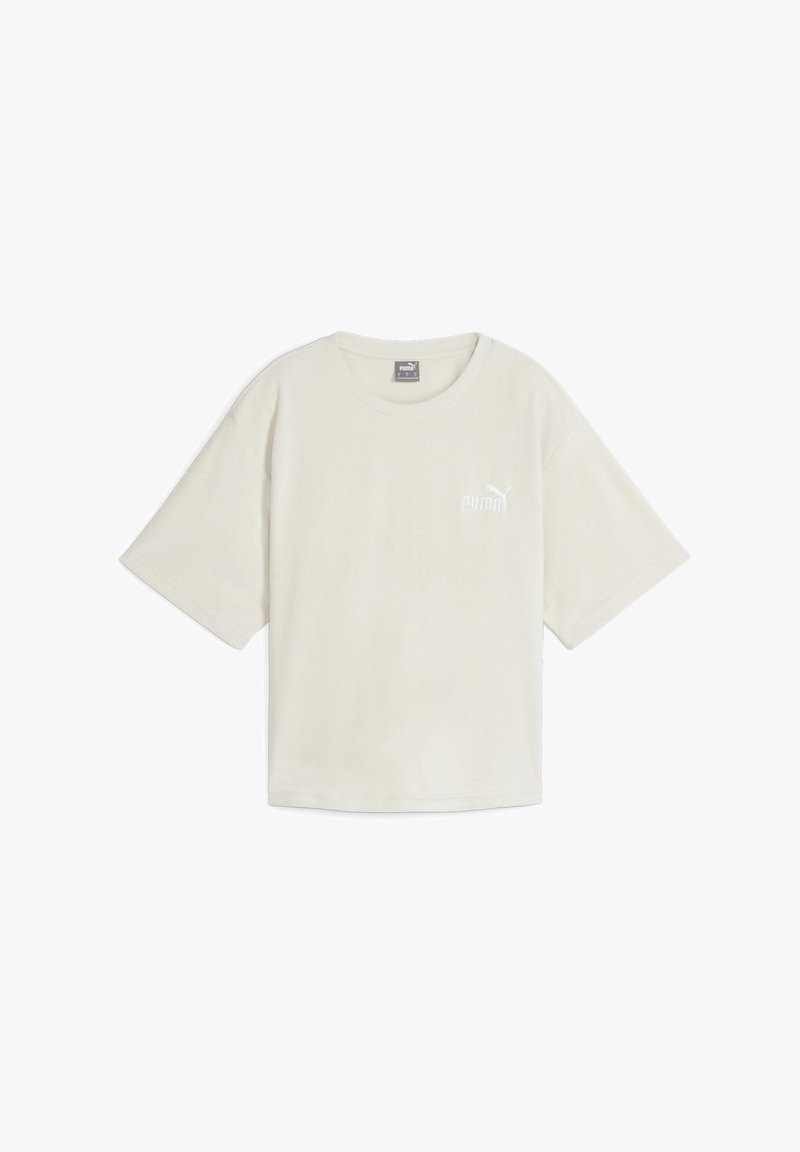 Krém színű, rövid ujjú póló puha pamutból, kerek nyakkivágással és kis fehér Puma logóval a bal mellrészen.