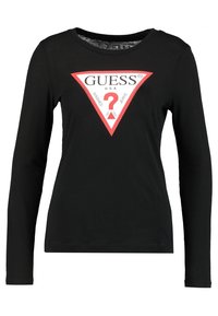 Zwart t-shirt met lange mouwen met een groot rood en wit driehoekig logo met "GUESS U.S.A." en een vraagteken in het midden. Zachte katoenen stof.