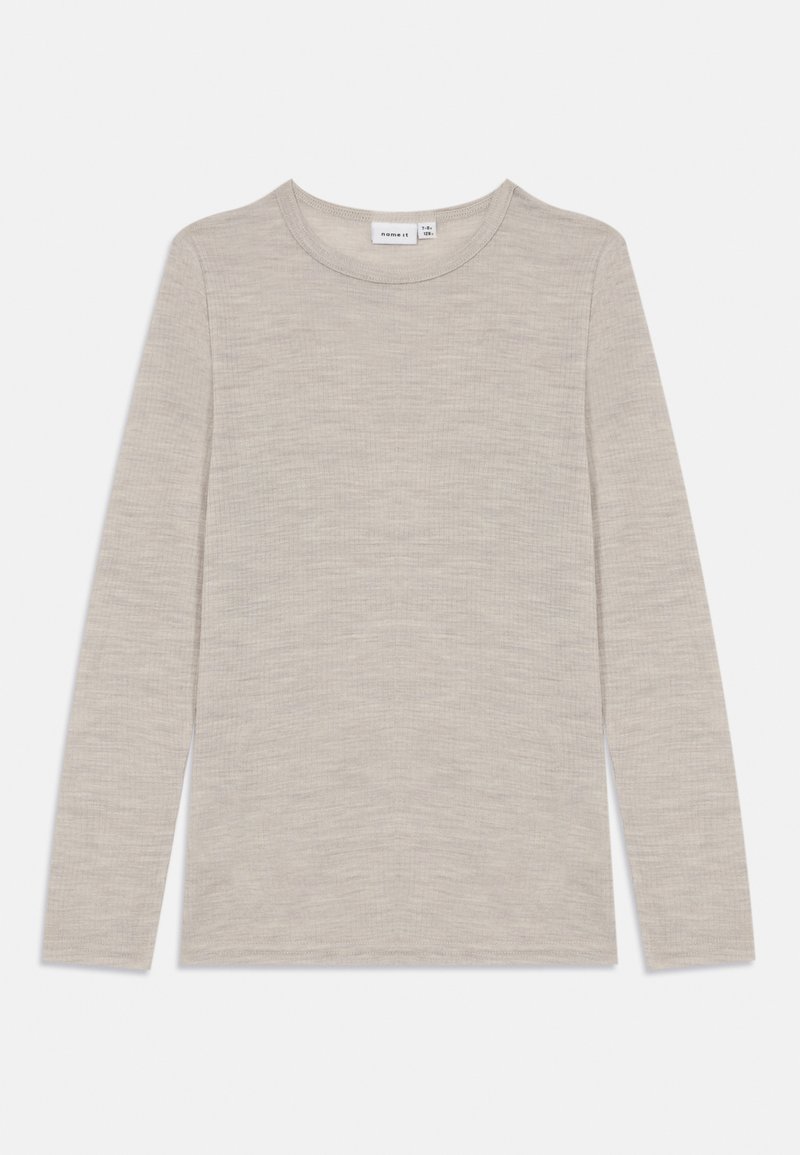 Long-sleeve, light beige top made of soft, textured fabric with a round neckline and finished hems. No visible patterns or accents.