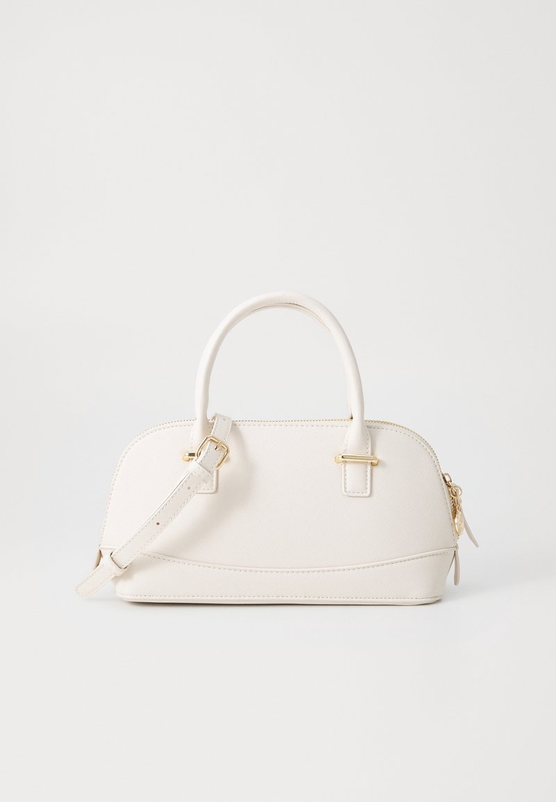 Petit sac à main en cuir blanc avec poignées arrondies, bandoulière réglable et détails en zip doré sur fond clair.