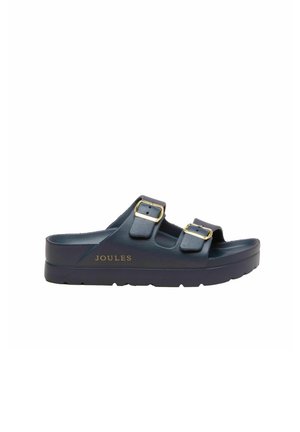 Sandale slide bleu marine avec deux boucles dorées réglables et une semelle épaisse marquée du nom de la marque Joules.