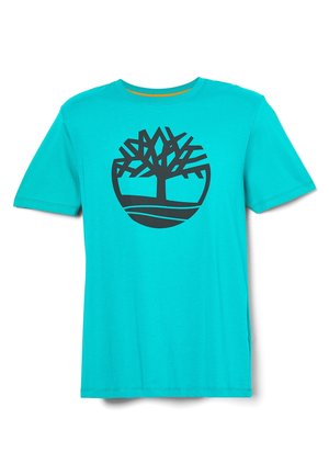 Turkusowy t-shirt z krótkim rękawem z czarnym abstrakcyjnym logo drzewa na środku klatki piersiowej.