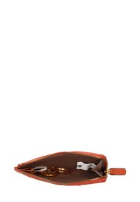 Orange textured zippered pouch featuring a brown interior, key rings inside, and a small tag attached. Gold hardware accents.