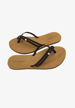 Schwarze Zehentrenner mit geflochtenen Riemen, hellbraunem Fußbett und geprägt "VOLCOM" Logo. Flache Sohle mit minimalem Profil für Traktion.