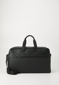 Black travel duffel bag made of smooth synthetic material, featuring two handles, an adjustable shoulder strap, and a front zippered pocket.