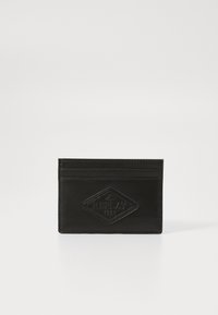 Black leather card holder featuring a diamond-shaped logo patch. It includes multiple card slots and a smooth, textured finish.