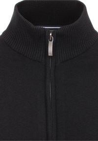 Svart zip-up tröja med ribbad krage och metallisk dragkedja. Materialet har en slät textur med en slim fit-design.