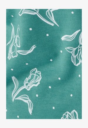 Tela verde azulado con patrón floral blanco y pequeños lunares; presenta formas de tulipanes con contornos definidos y textura suave.