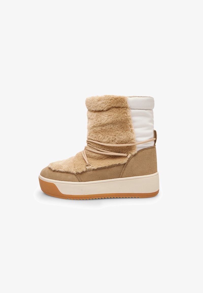 Tan faux fur and suede ankle boot with a white padded upper, brown side accents, round toe, and textured rubber sole with grooves.