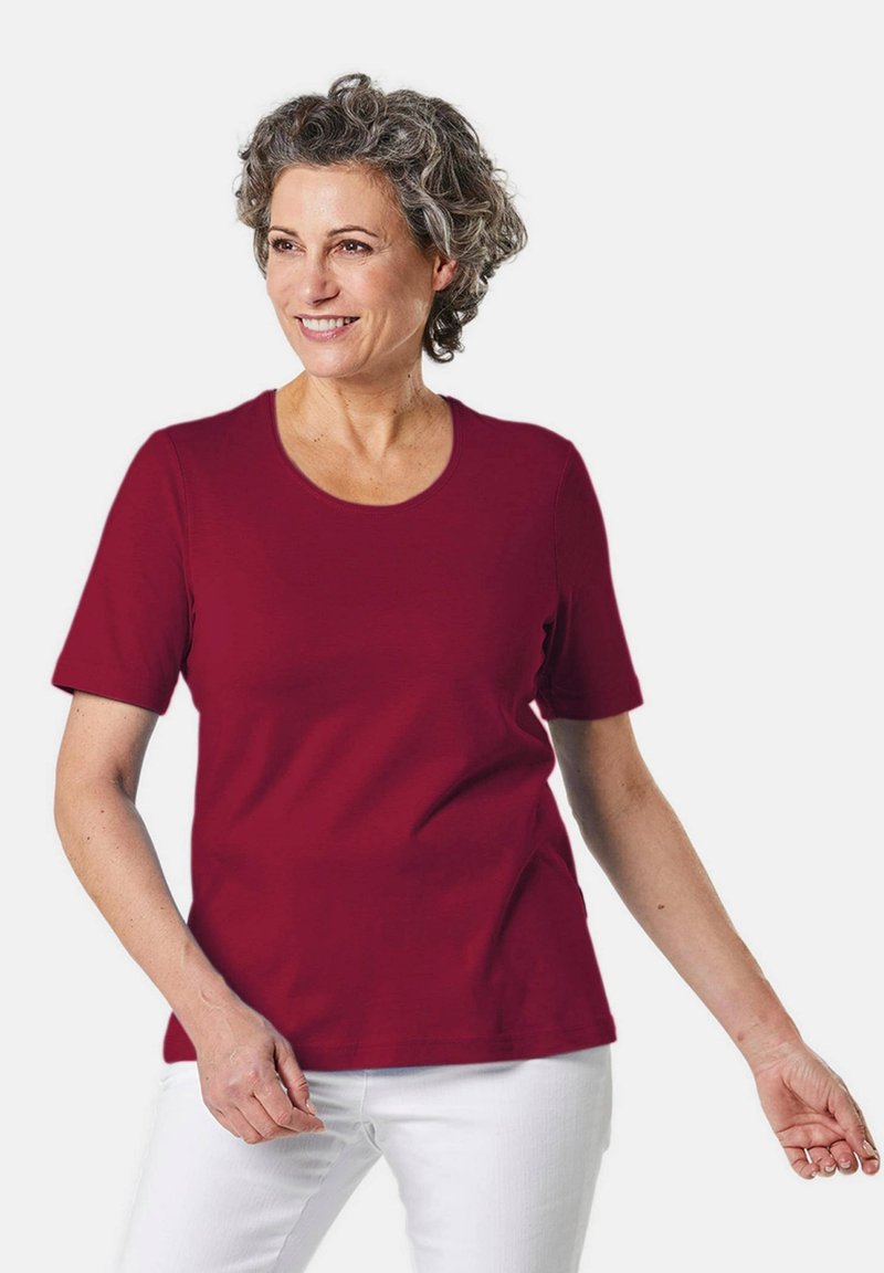 Bordeauxkleurig T-shirt met korte mouwen en een ronde hals, gemaakt van zachte stof. Heeft een gladde textuur en een klassieke pasvorm.