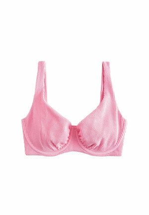 Roosa tekstuuriga riidest rinnahoidja aluseks olevate karpidega ja laiate õlarihmadega, esitatud valgel taustal.