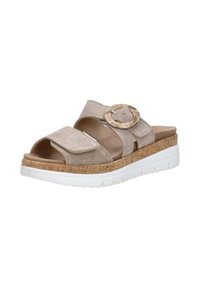 Beige suede slide sandals with a cork platform and white rubber sole. Features a wide strap and round faux wood accent buckle.