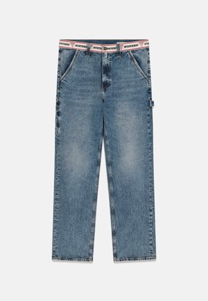 Straight-leg blue denim jeans with a frayed hem and a white waistband featuring red and black "HYSTERIC" text.