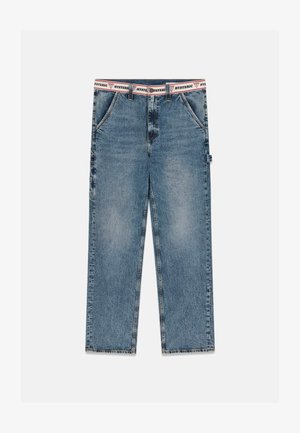 Straight-leg blue denim jeans with a frayed hem and a white waistband featuring red and black "HYSTERIC" text.