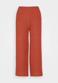 Pantalon large pour femme de couleur rouille avec taille élastique et tissu texturé, présenté sur un fond blanc uni.