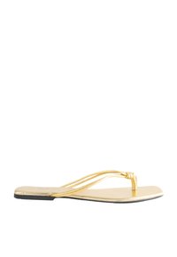 Goldene flache Sandalen mit schlankem Design, die dünne geflochtene Riemen und eine flache Sohle aufweisen, ideal für legere Sommerkleidung.