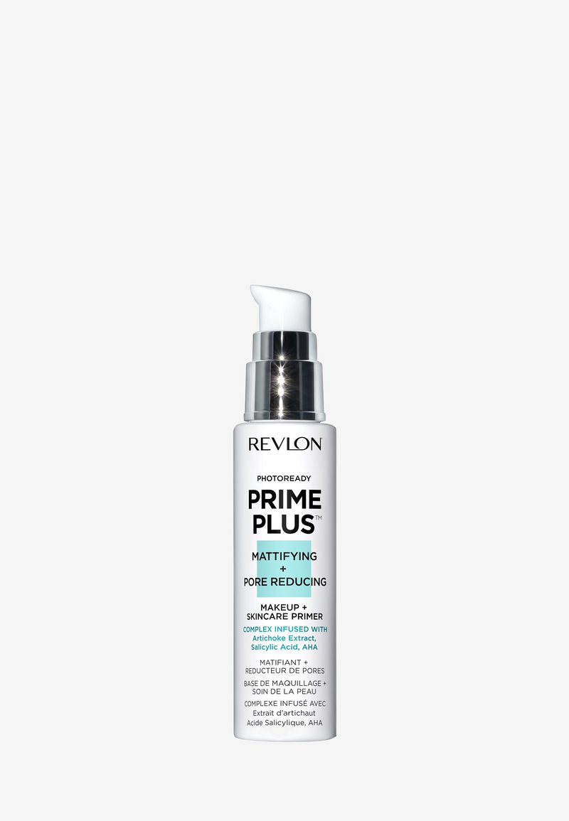 La base de maquillage Revlon Photoready Prime Plus dans un flacon blanc avec des accents argentés. Présente un embout pompe ; étiquetée pour matifier et réduire les pores.