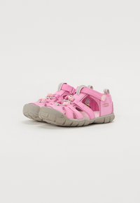 Pink sandals with gray accents, featuring a mesh upper, adjustable straps, and a textured rubber sole for traction. Lightweight design.