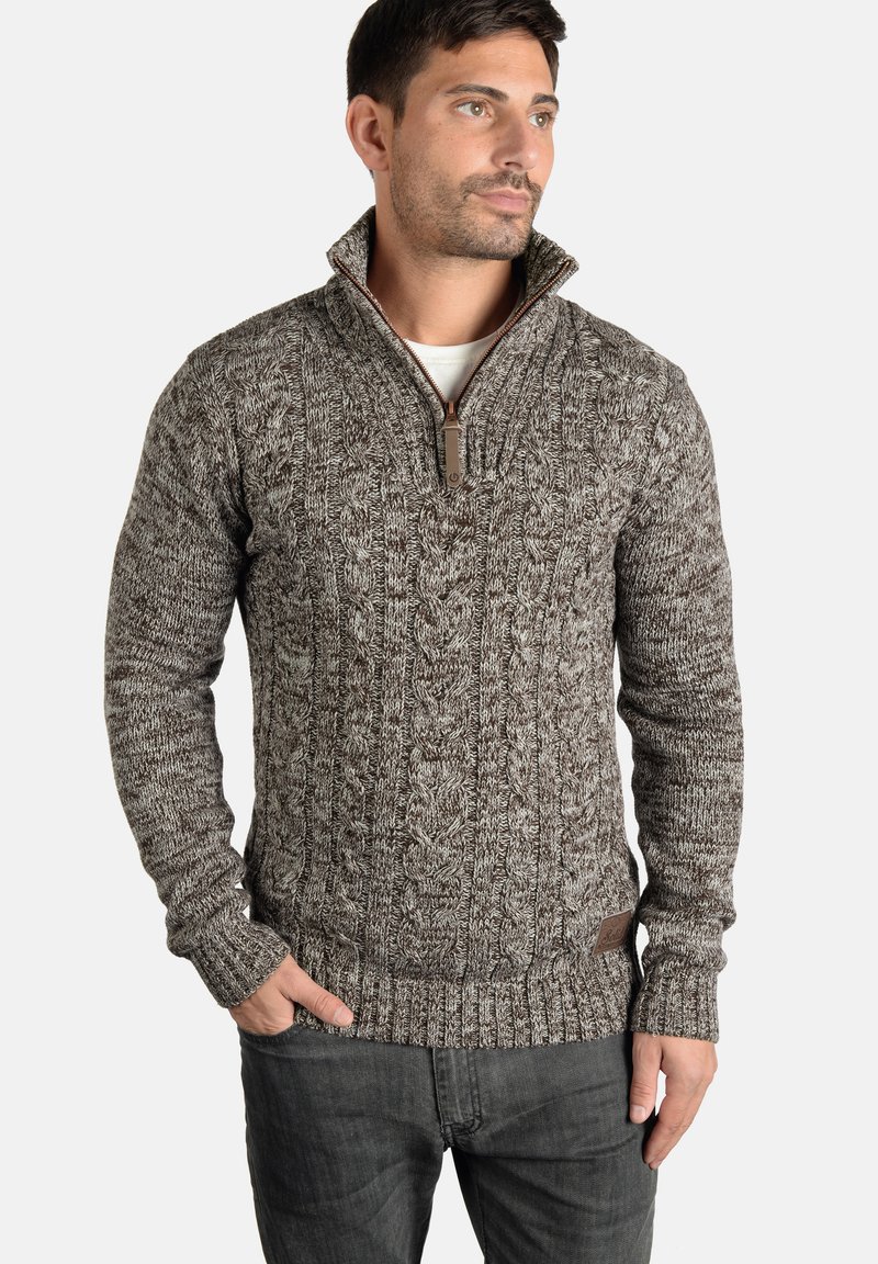 Cable-knit sweater in brown and gray tones, featuring a zip collar, ribbed cuffs, and hem, made from a textured knit material.