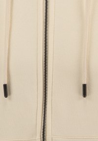 Beige zip-up hoodie met gevlochten trekkoorden, een contrasterende zwarte rits en een gladde textuur. Heeft een standaard pasvorm en een eenvoudig ontwerp.