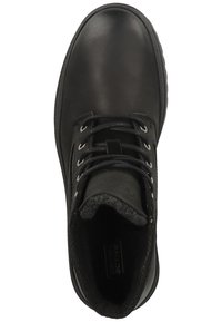 Black ankle boot with smooth leather upper, round toe, lace-up front, and soft fur lining. Features logo and sturdy rubber sole.