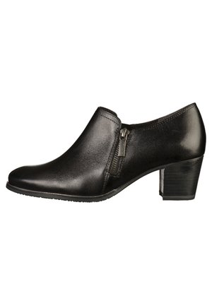 Chaussure pour femme en cuir noir, à talon bas, avec fermeture éclair latérale, bout rond, finition lisse, et talon bloc empilé.