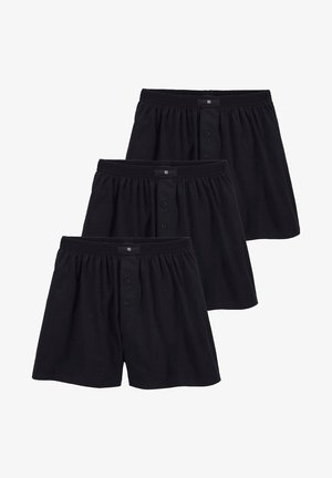 Schwarze Baumwollboxershorts, dreiteiliges Set, mit einem elastischen Bund und Knöpfen vorn. Glatte Textur, normale Passform, ohne Muster oder Akzente.