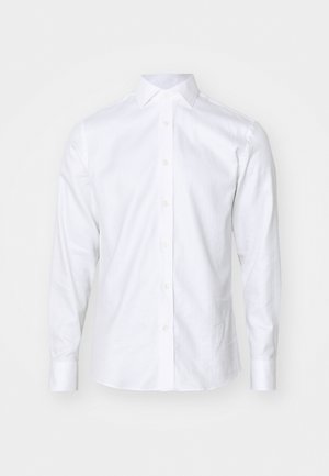 Weißes Langarm-Hemd aus Baumwolle mit klassischem Kragen, Knopfleiste und gesteckten Manschetten. Glatte Textur, minimalistisches Design.