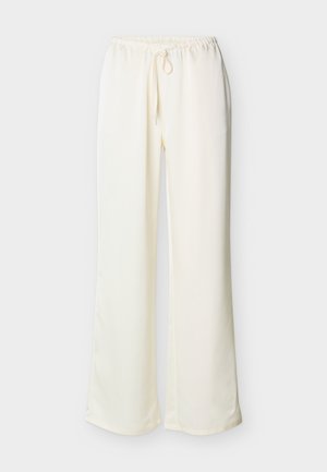 Εκρού φαρδιά παντελόνια με ελαστική μέση και κορδόνι στη μπροστινή όψη, παρουσιάζονται σε απλό ανοιχτό φόντο.