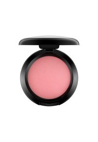 Fard à joues en compact avec un extérieur noir. Comprend une poudre ronde, rose pâle, ayant une texture lisse et un motif légèrement strié.