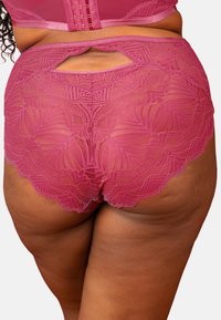 Lace brief in rich rose pink with intricate floral patterns. Features a cutout at the back and scalloped edges for added detail.