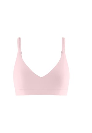 Light pink wireless bra with adjustable shoulder straps and smooth, seamless cups on a white background.