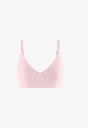 Light pink wireless bra with adjustable shoulder straps and smooth, seamless cups on a white background.