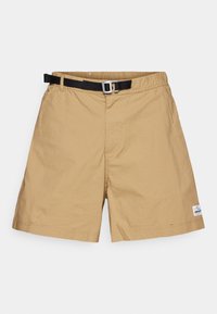 Beige shorts lavet af letvægtsstof. Har en elastisk talje med et sort justerbart bælte og et lille brandlogo i kanten.